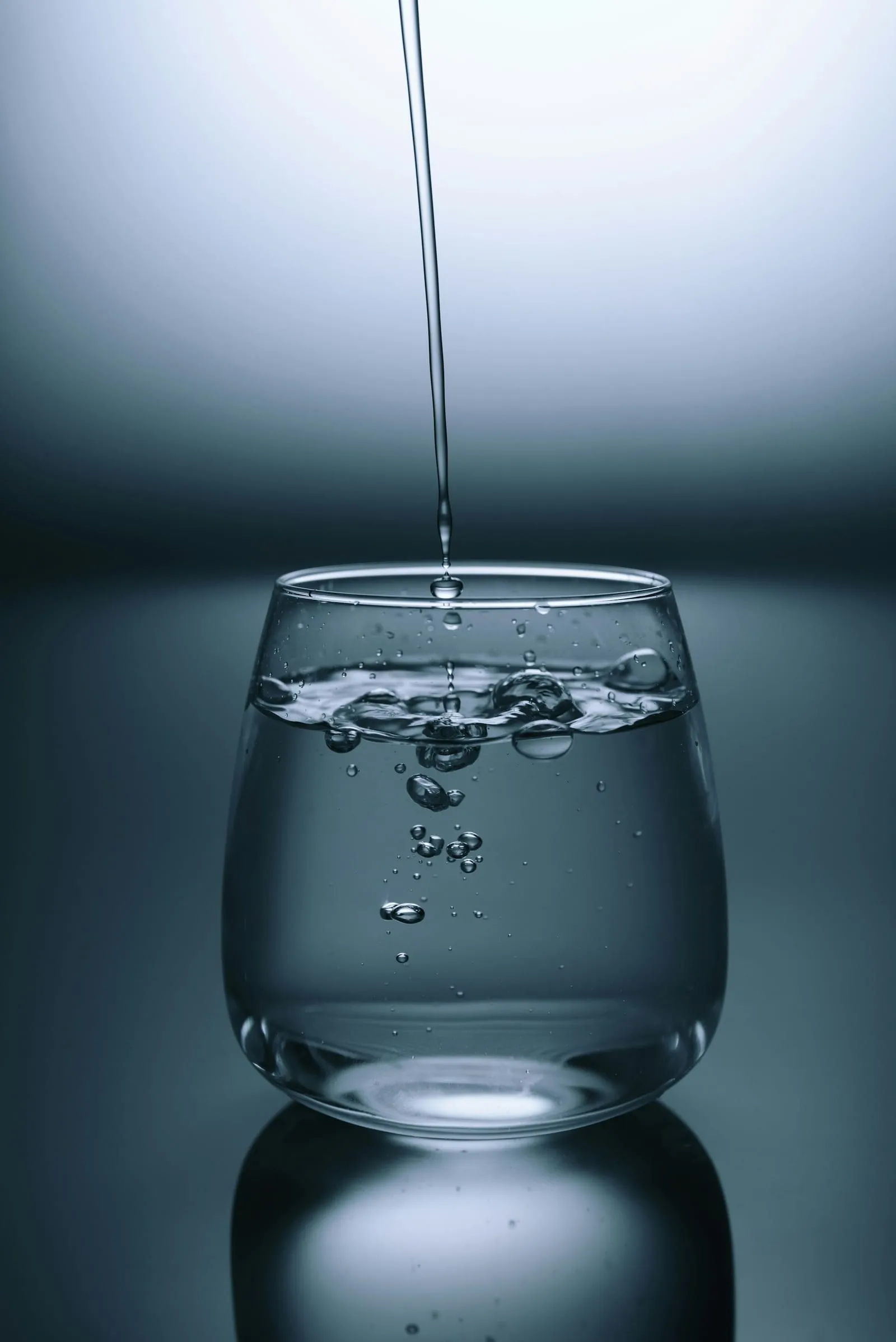 Water being poured into a clear glass